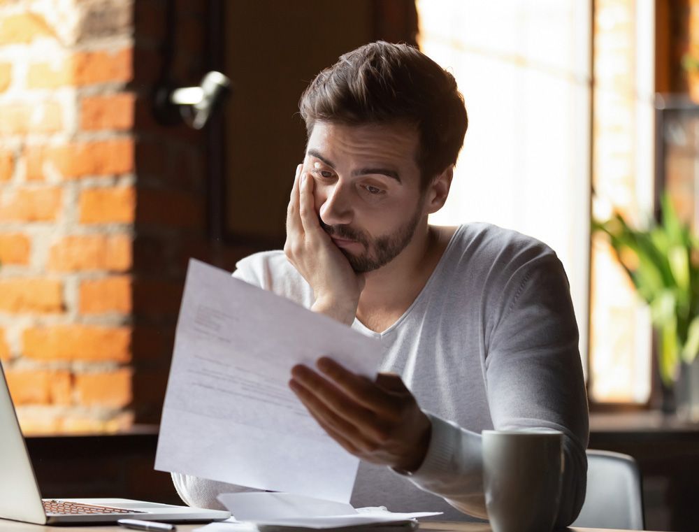 Man Looking on His Contract — Mount Gambier, SA — Kyrimis Lawyers