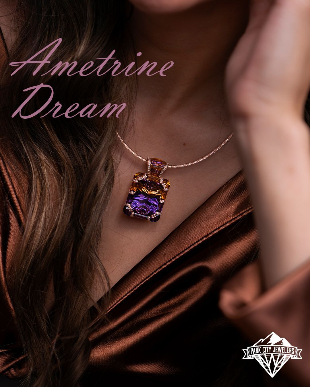 An image of a stunning Bellarri ametrine pendant from Park City Jewelers. The pendant features a vibrant ametrine gemstone, beautifully cut and set in a gold pendant setting. The image showcases the intricate details of the pendant, including the delicate metalwork and the mesmerizing color combination of amethyst and citrine in the gemstone. This Bellarri pendant is a true masterpiece, capturing the essence of elegance and sophistication. A perfect accessory for those seeking a touch of luxury. Visit Park City Jewelers to explore their exquisite collection of fine jewelry.