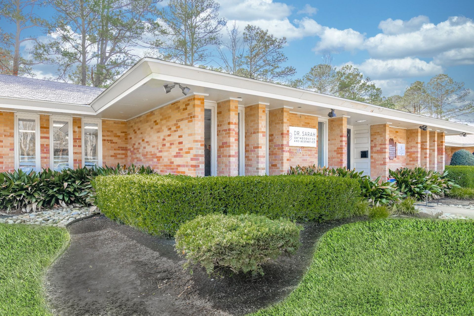a brick building with a sign that says dr. sarah on it