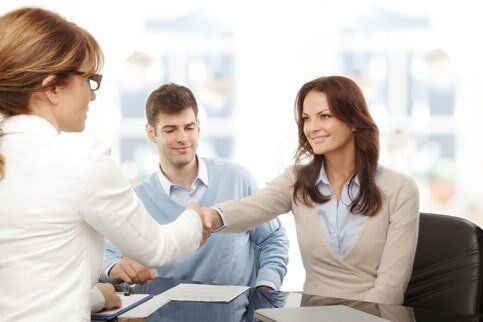 Agent shaking the hands of their client - Accountancy in Huntington Beach, CA