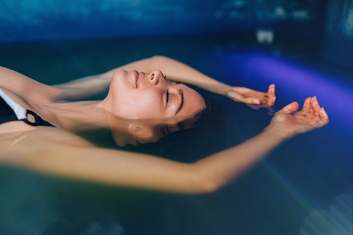 woman lying down in shallow pool