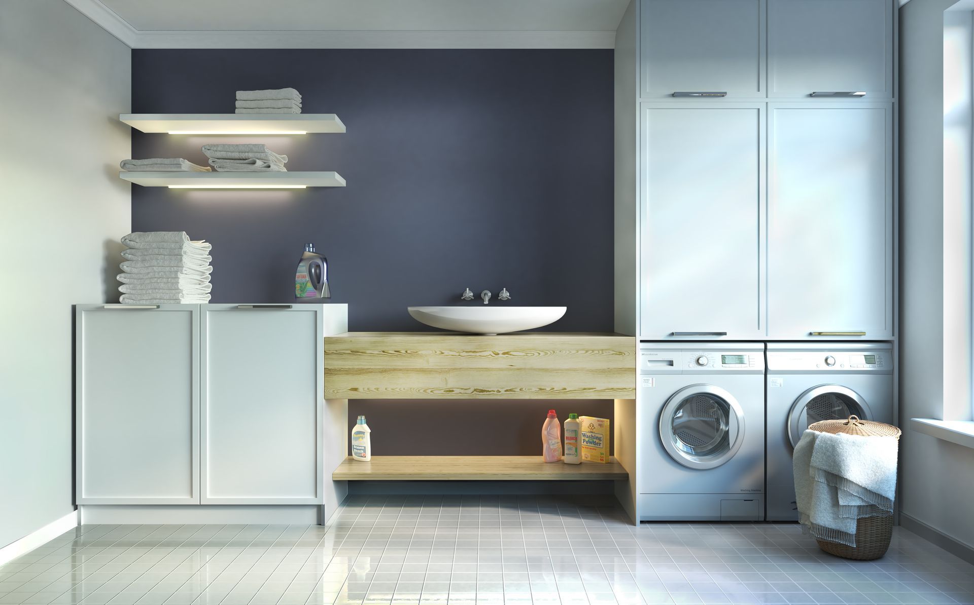 White kitchen with gray countertops, stainless steel appliances, and white subway tile backsplash.