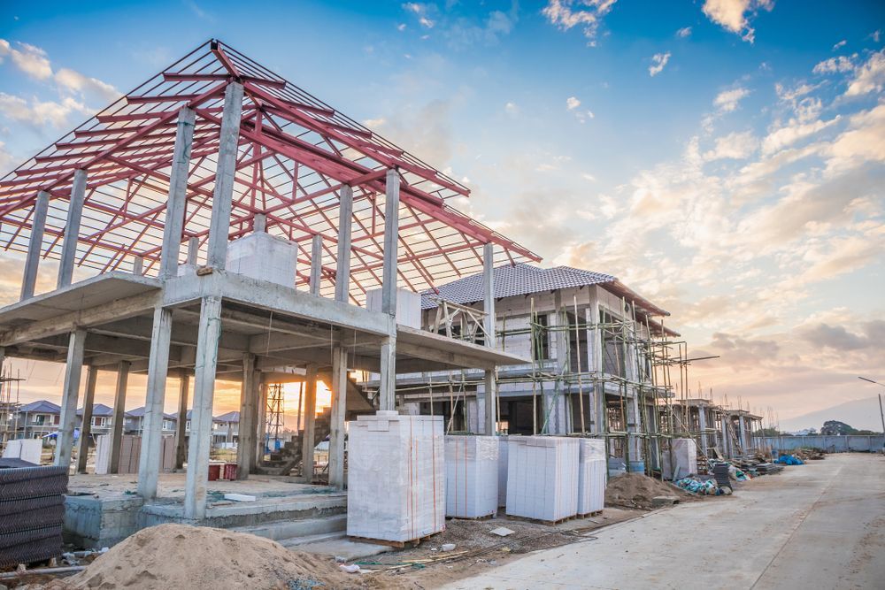 Building Construction Site: Concrete Frame, Red Roof Beams — Rowal Constructions in New Lambton, NSW