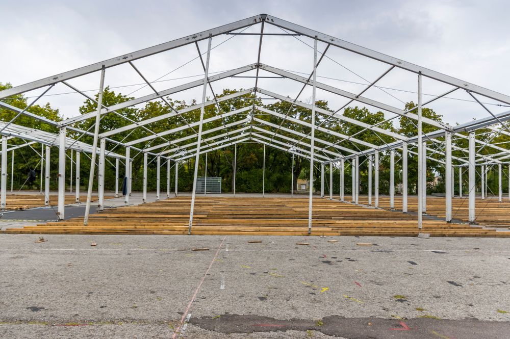 Metal Framework of a Large Tent Under Construction on a Concrete Surface — Rowal Constructions in Hamilton, NSW