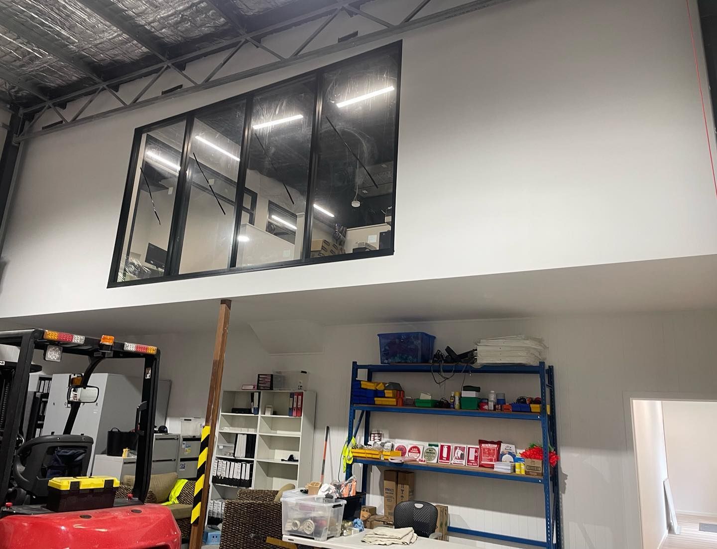 Warehouse Interior With Mezzanine Office; Forklift, Shelving — Rowal Constructions in Belmont, NSW