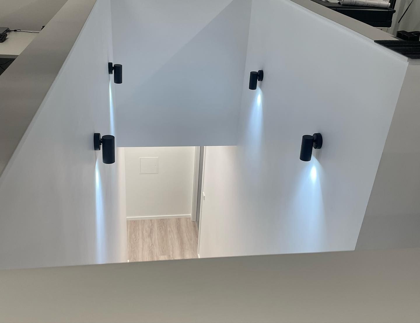 White Walls With Inset Lights Illuminate a Hallway Entrance With a Light Wood Floor — Rowal Constructions in Warners Bay, NSW