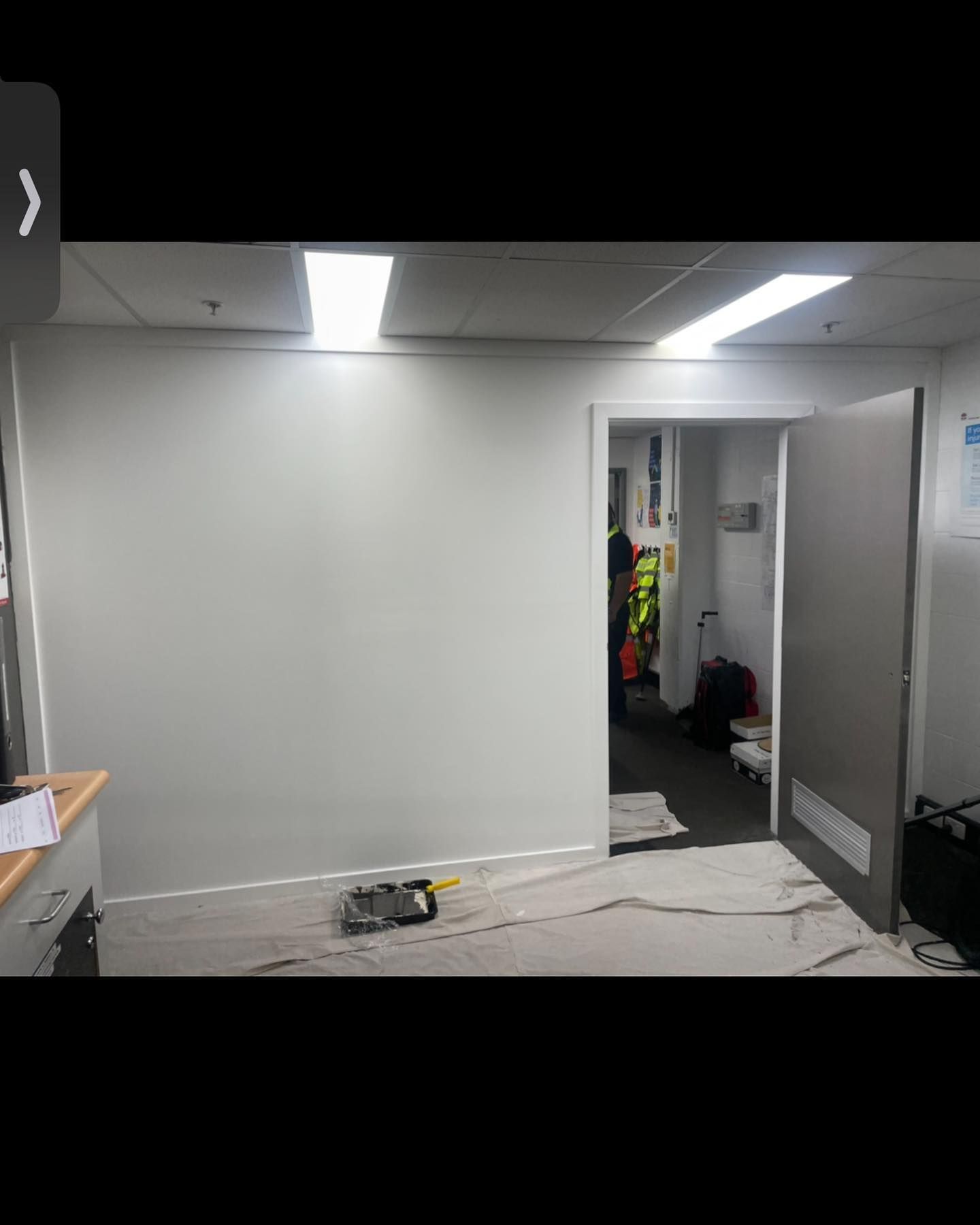 White Painted Office Wall With Doorway; Paint Roller on Drop — Rowal Constructions in Cardiff, NSW