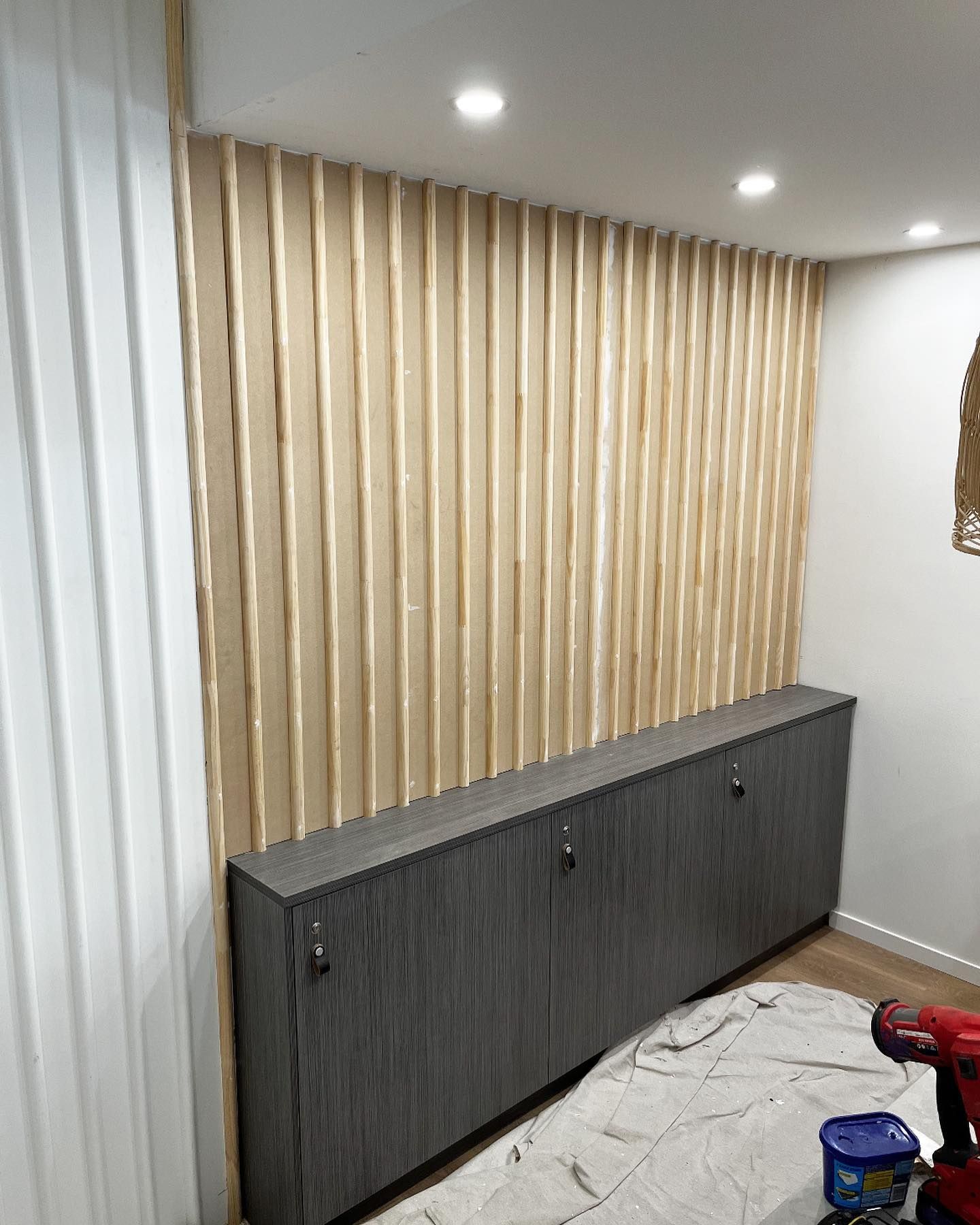 Wooden Slat Accent Wall Above Gray Cabinet — Rowal Constructions in New Lambton, NSW