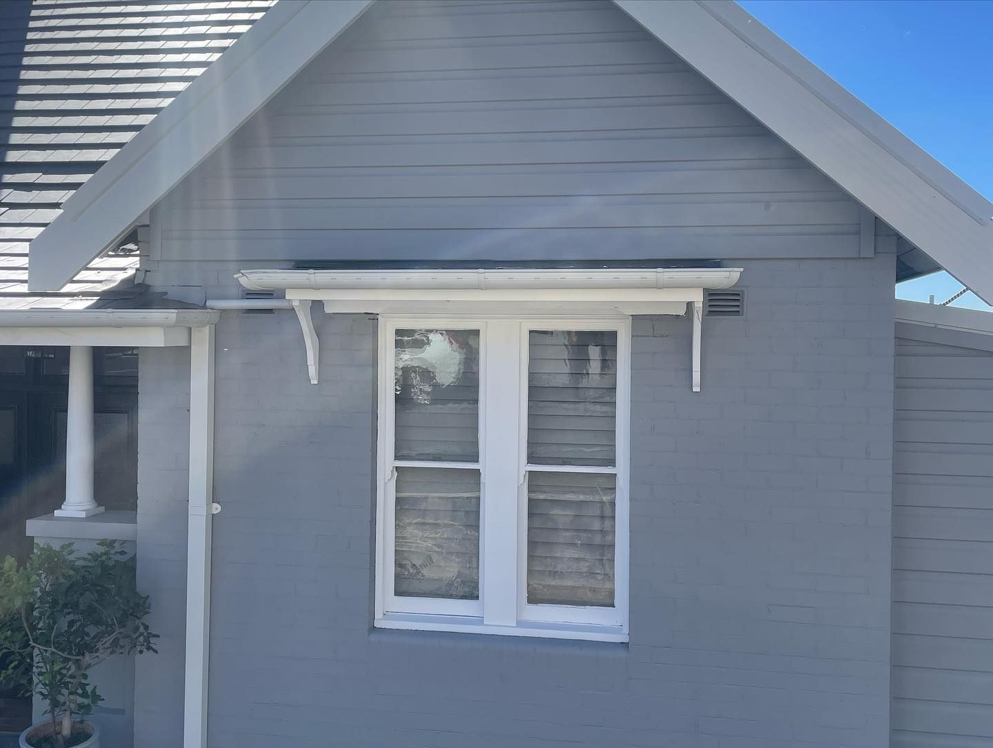 Grey House With White Window Frame, Awning, and Trim — Rowal Constructions in Hamilton, NSW
