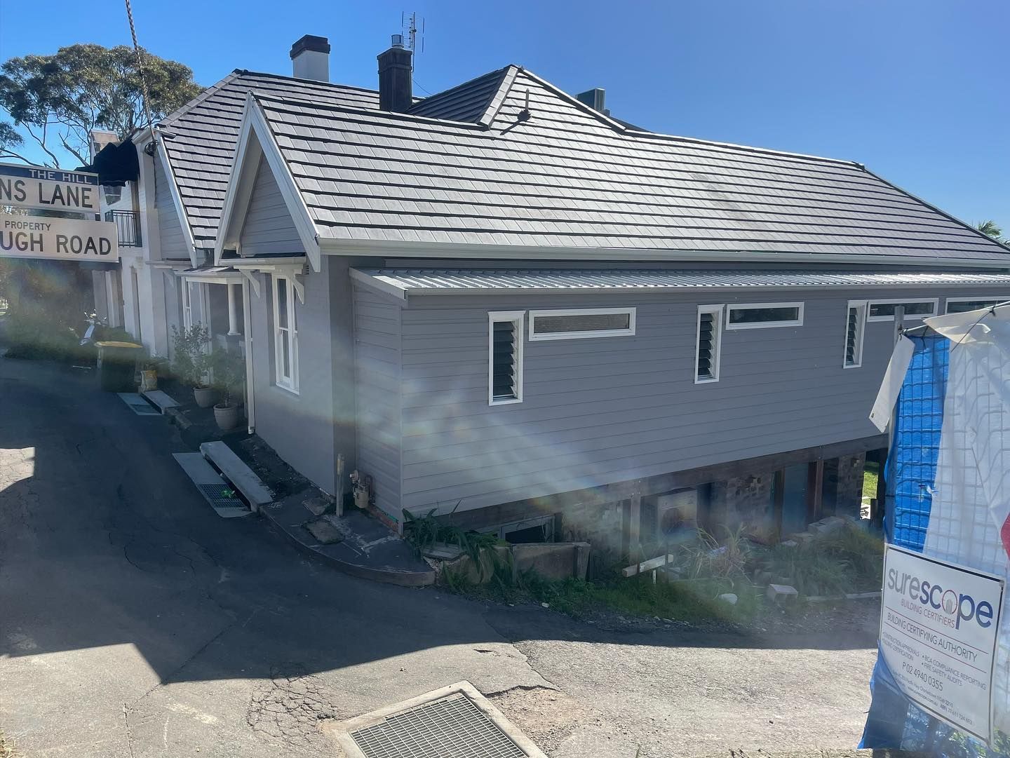 Gray House With a Gray Tile Roof and Gray Siding — Rowal Constructions in Charlestown, NSW