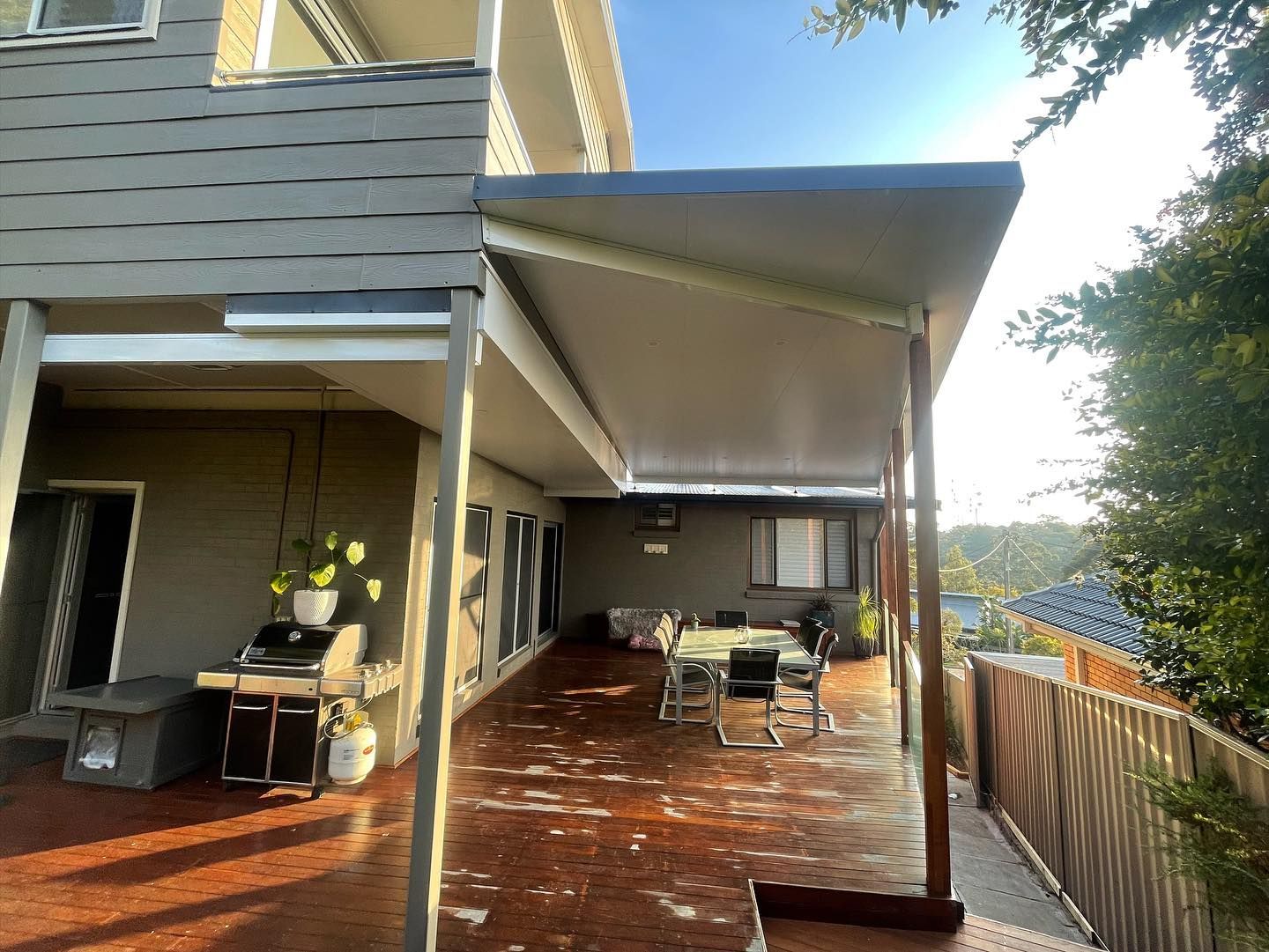 Patio With a Shaded Roof, Wooden Deck, Outdoor Dining Set — Rowal Constructions in Belmont, NSW