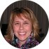 A woman is smiling for the camera in a circle.