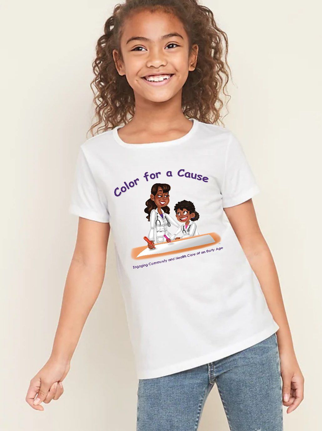 A little girl wearing a white t-shirt that says color for a cause