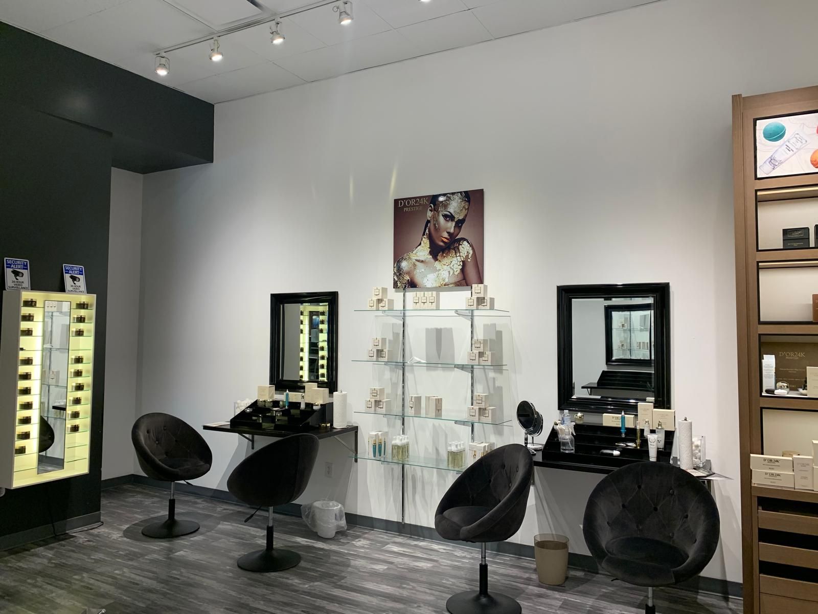 Interior of an eyewear shop with display of frames and accessories, mirrors, and chairs.