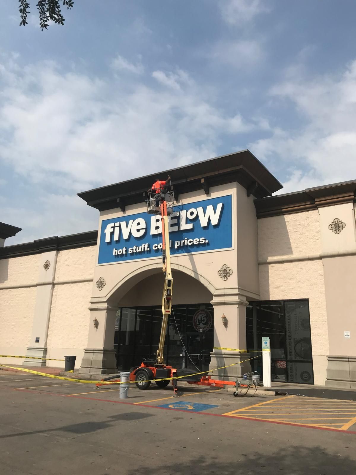 A person on a lift repairing the 