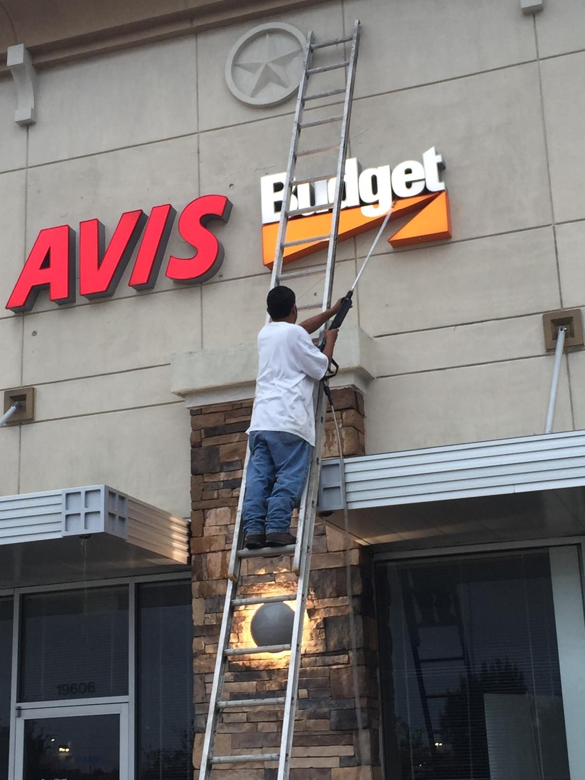 Person on a ladder repairs the 