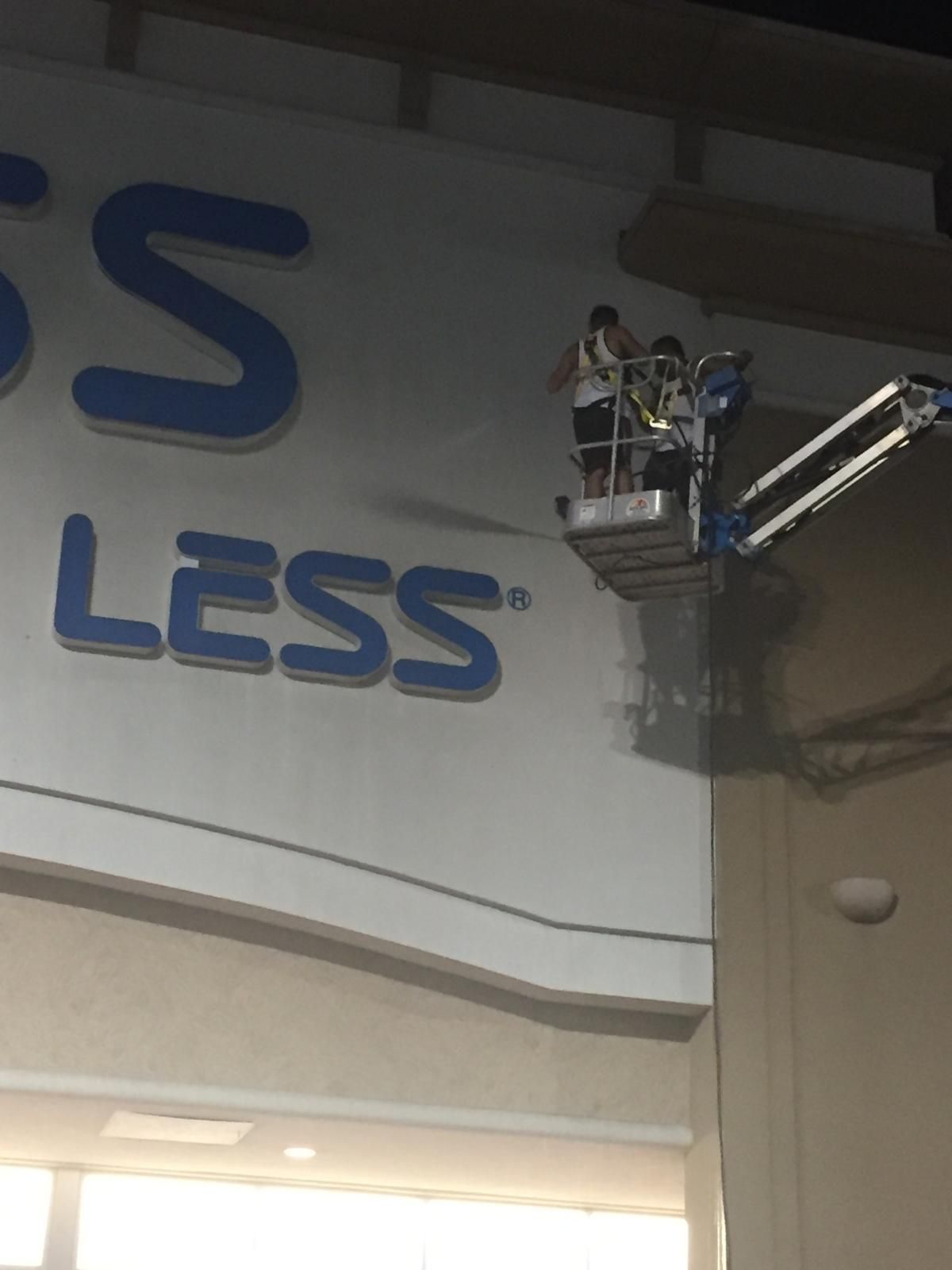 Workers in a lift cleaning the 