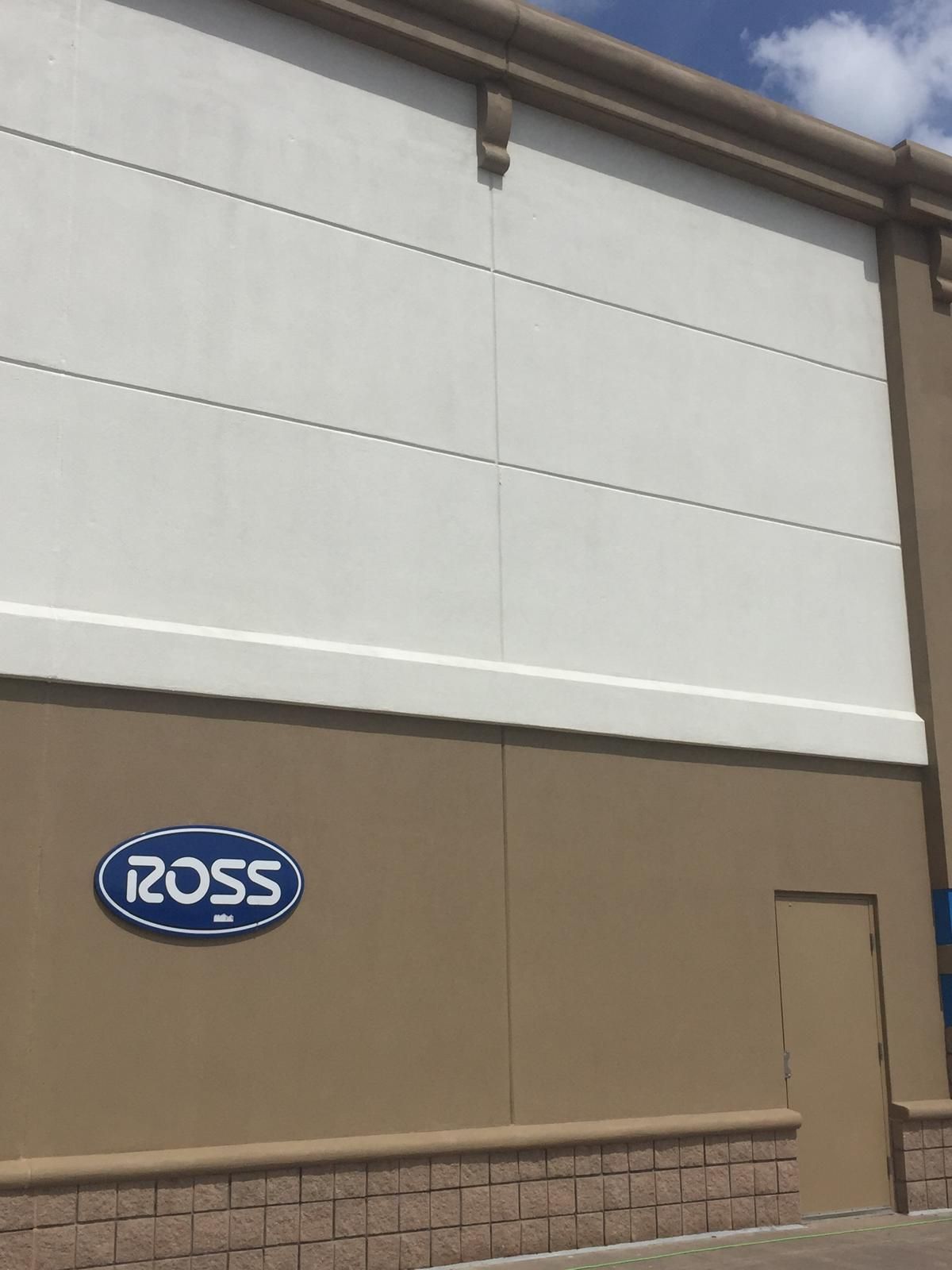 Ross store exterior with brown and white walls, blue logo, and a door.