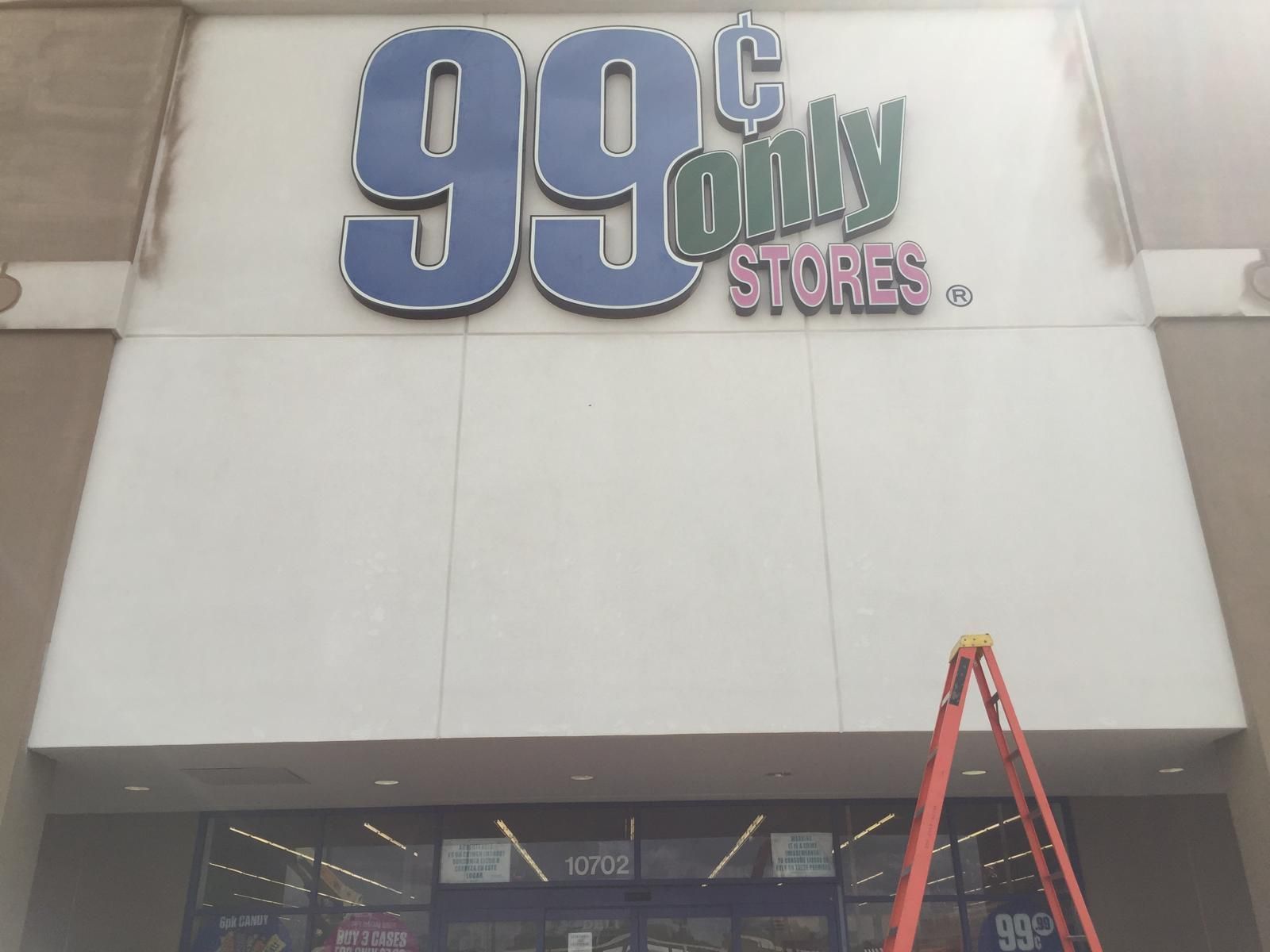 99 Cents Only Stores storefront with sign on a beige building, with a ladder set up.