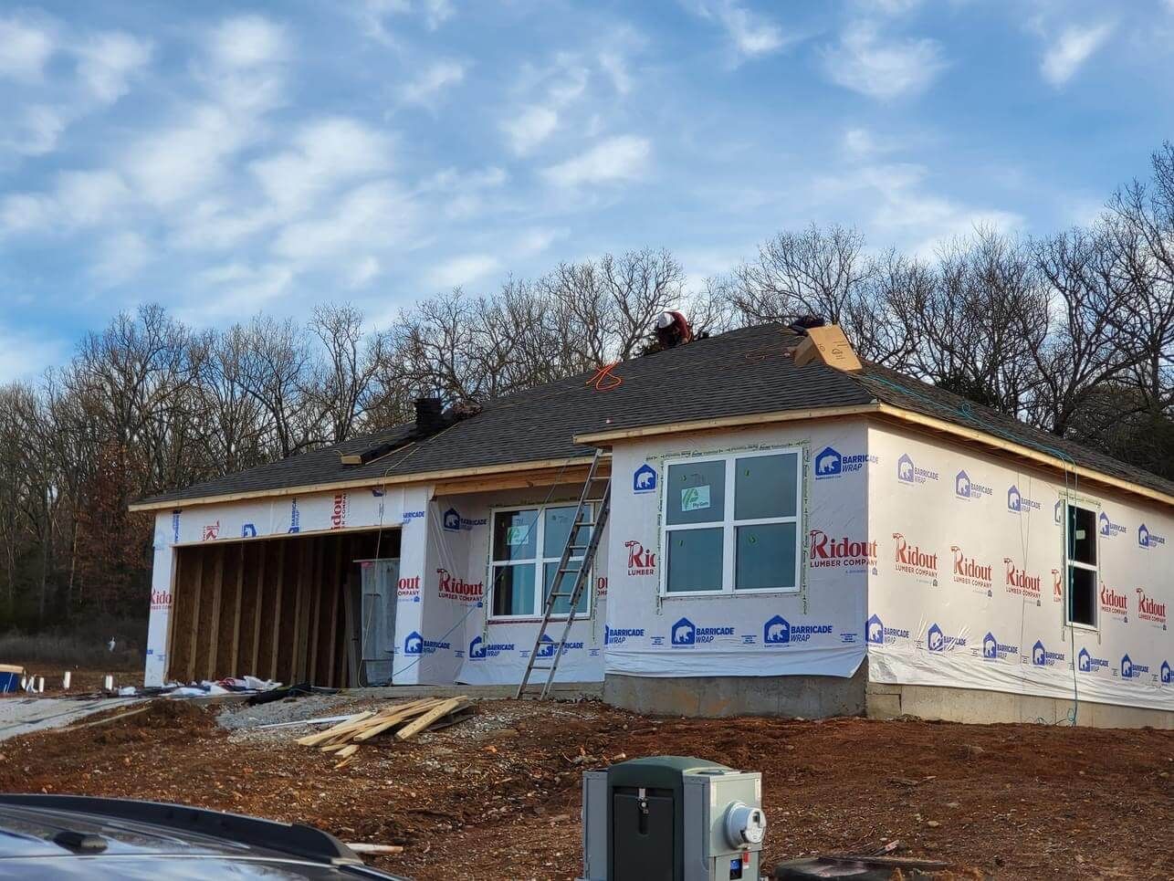A house is being built in the middle of a forest.