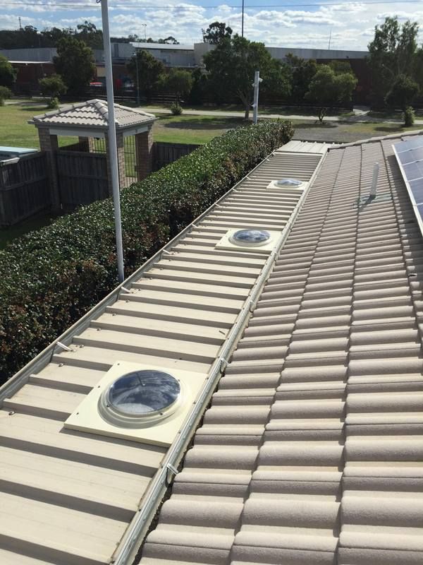 Roof of a house with three skylights — Lilydale, QLD — SunCity Skylights