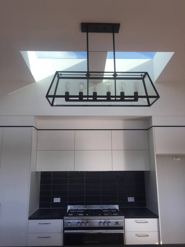 Kitchen with a stove and a skylight above it — Lilydale, QLD — SunCity Skylights