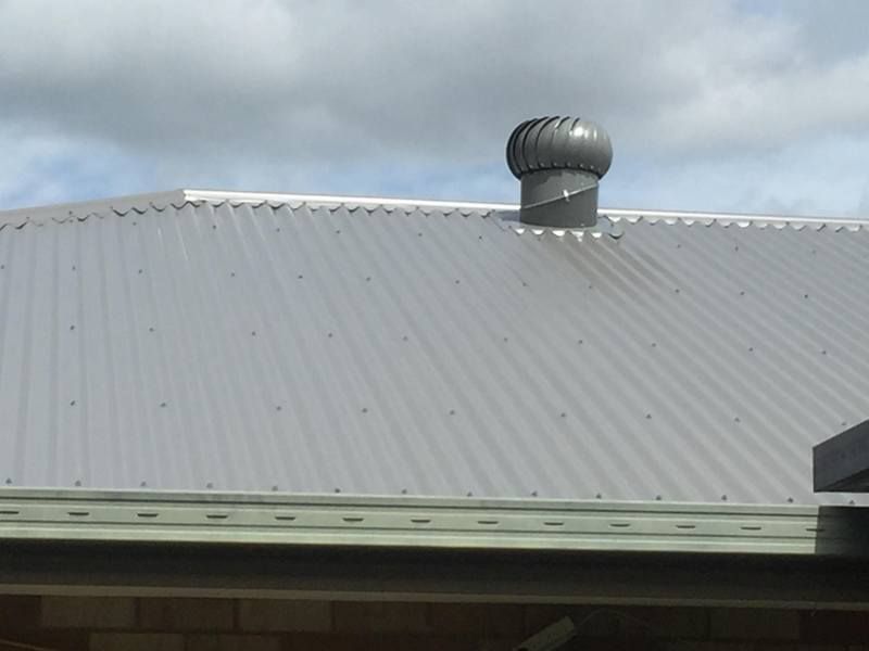 Roof with a wind turbine on top of it  — Lilydale, QLD — SunCity Skylights