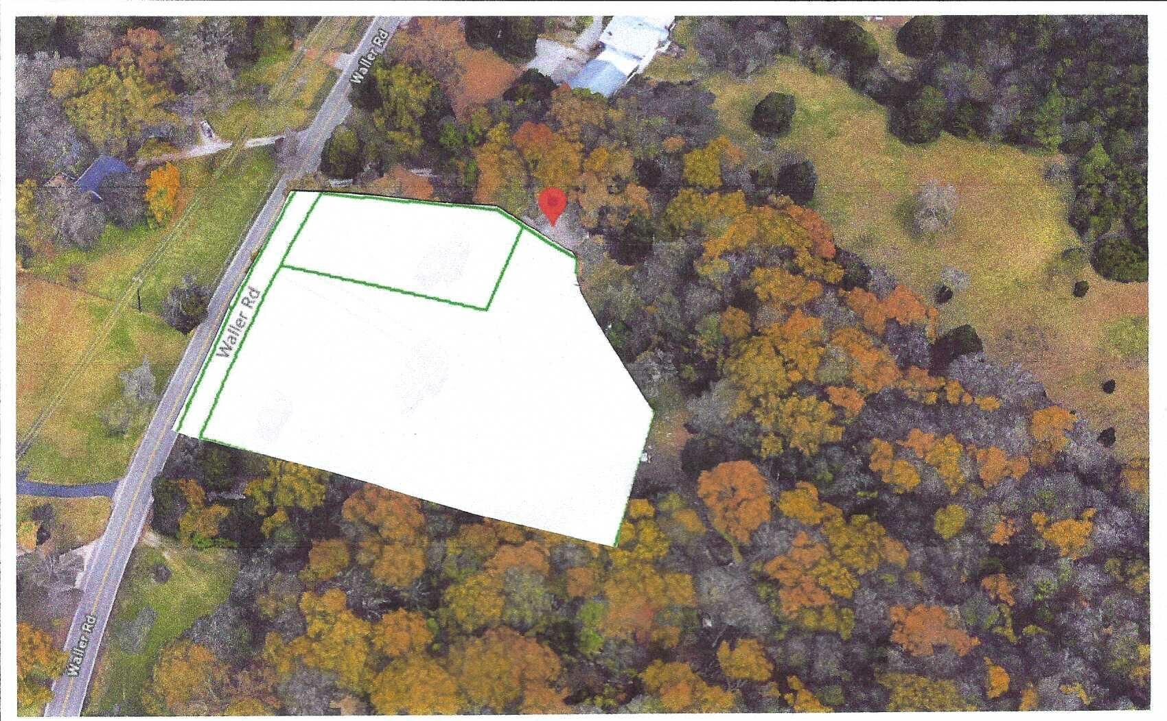 A living room with a couch , chairs , ottoman and a mirror