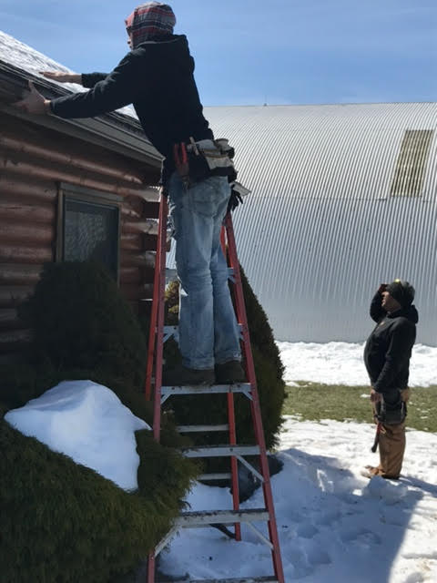 Gutter Cleaning — Man on Ladder in Berwick, PA