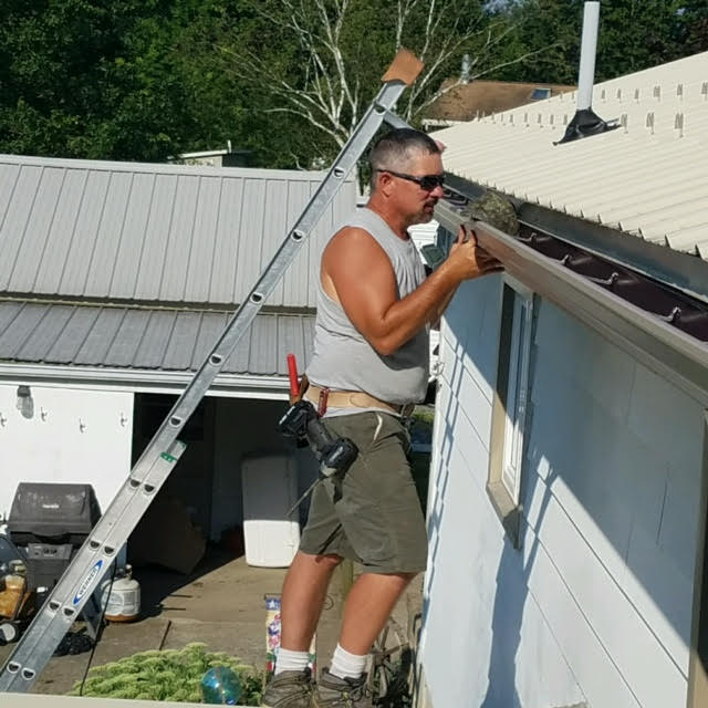 Raytec Real Gutter Cover — Man Cleaning Gutter in Berwick, PA