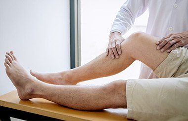 Therapist Checking Patients Knee — Reno, Nevada — ATS Physical Therapy