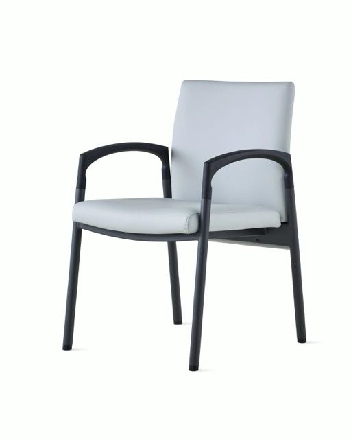 Modern light gray upholstered chair with black frame on a white background