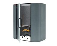 Small soundproof office pod with an open glass door, desk, and yellow chair inside.