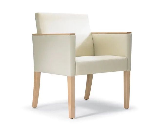 White upholstered armchair with light wooden legs on a white background