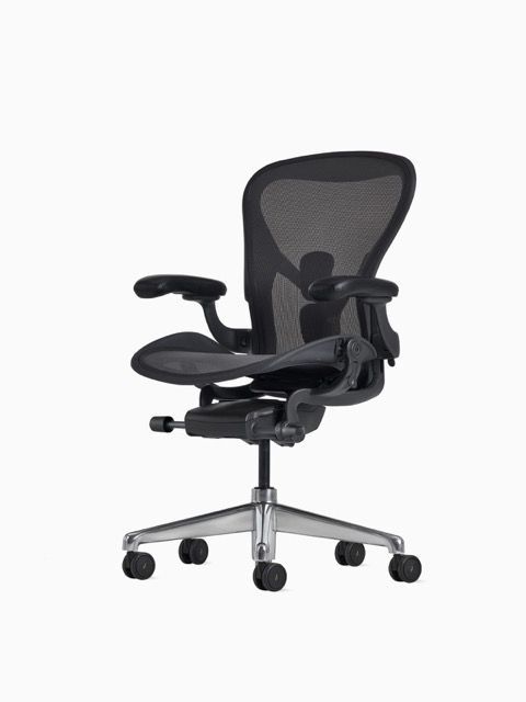Black ergonomic office chair with mesh back and silver base on a white background