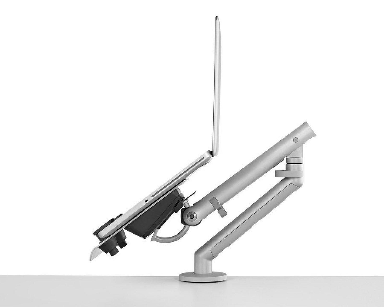Adjustable silver laptop stand with an open laptop on a desk arm mount