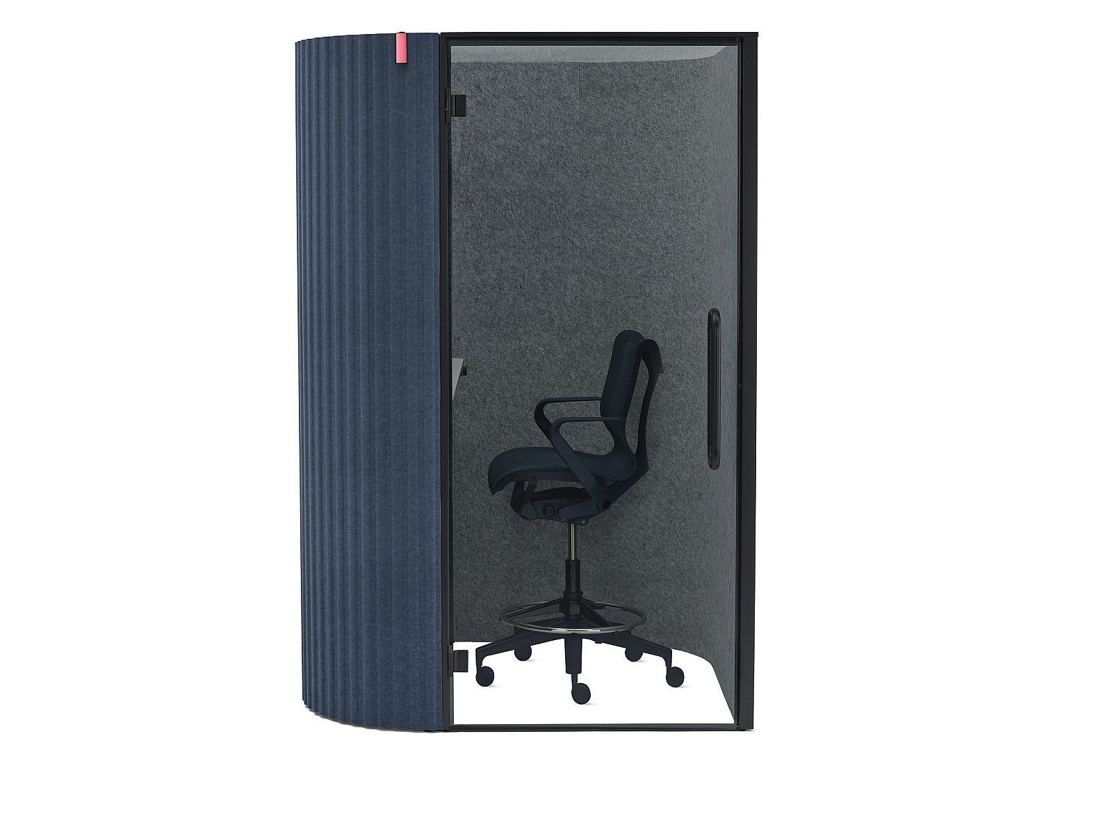 Single-person office pod with an open door and black chair inside