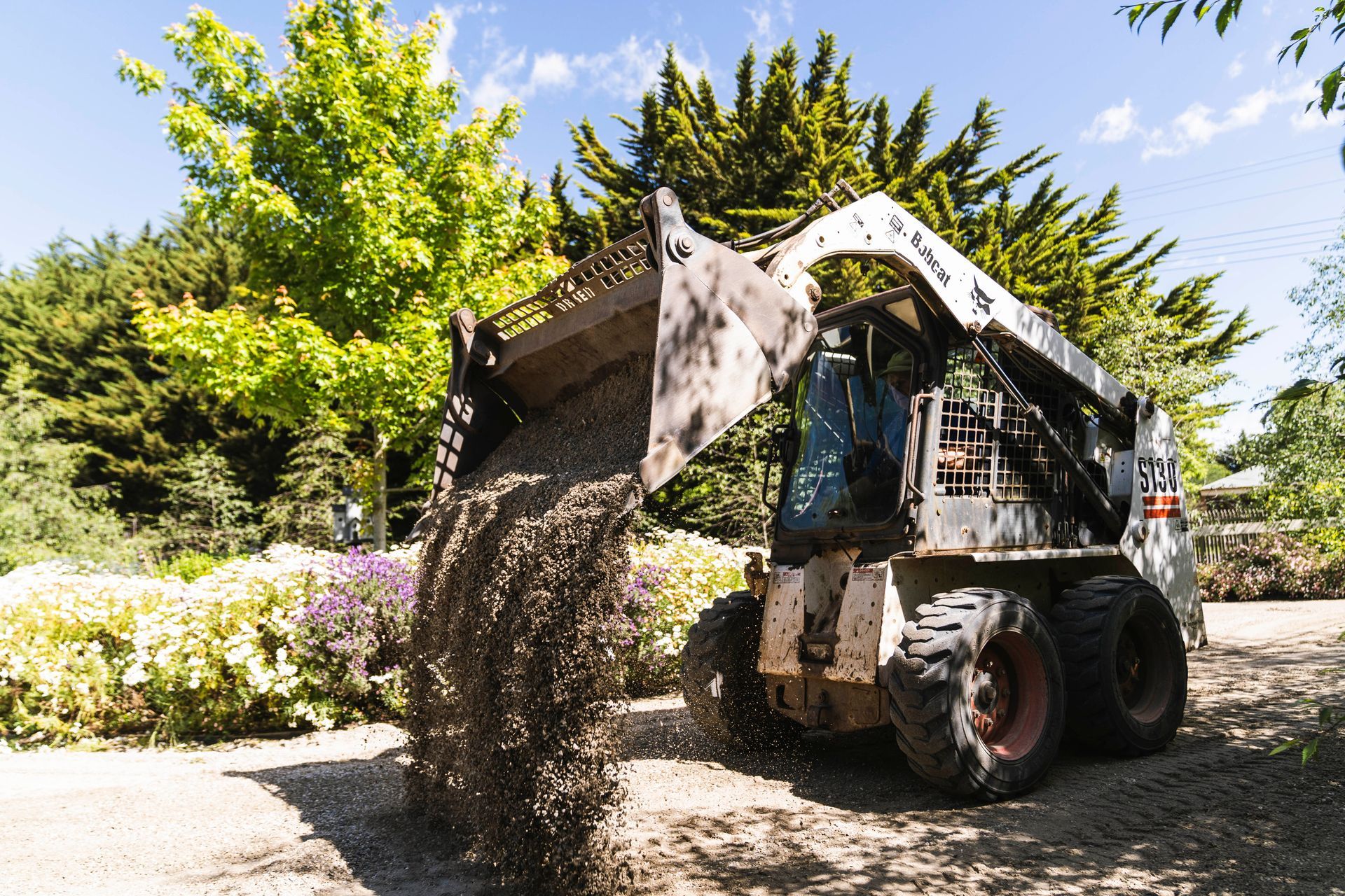 Bobcat unloading gravel