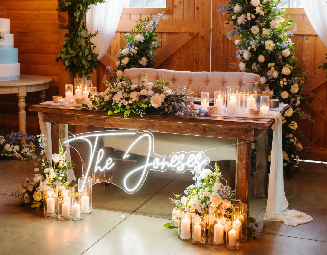 A bride and her bridesmaids are posing for a picture in front of a brick building.