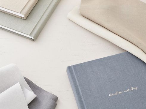 Heirloom wedding albums scattered on a surface