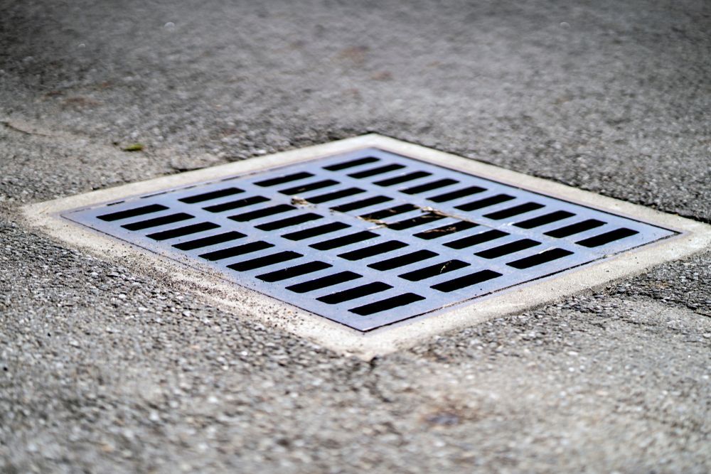 Square Metal Drain Set in Concrete — B&T Earthworks & Civil in Yorkeys Knob, QLD