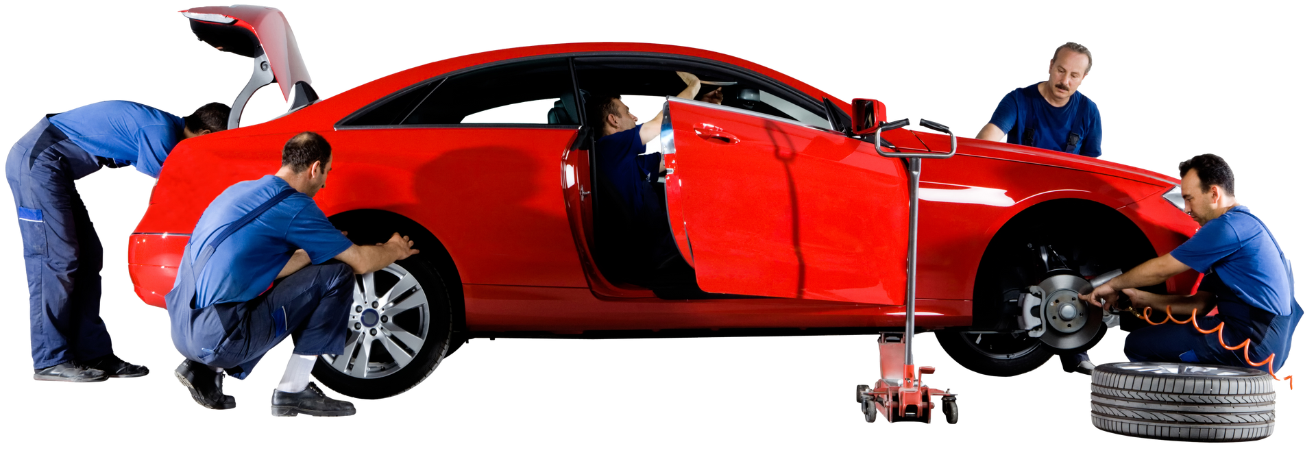 A group of men are working on a red car.