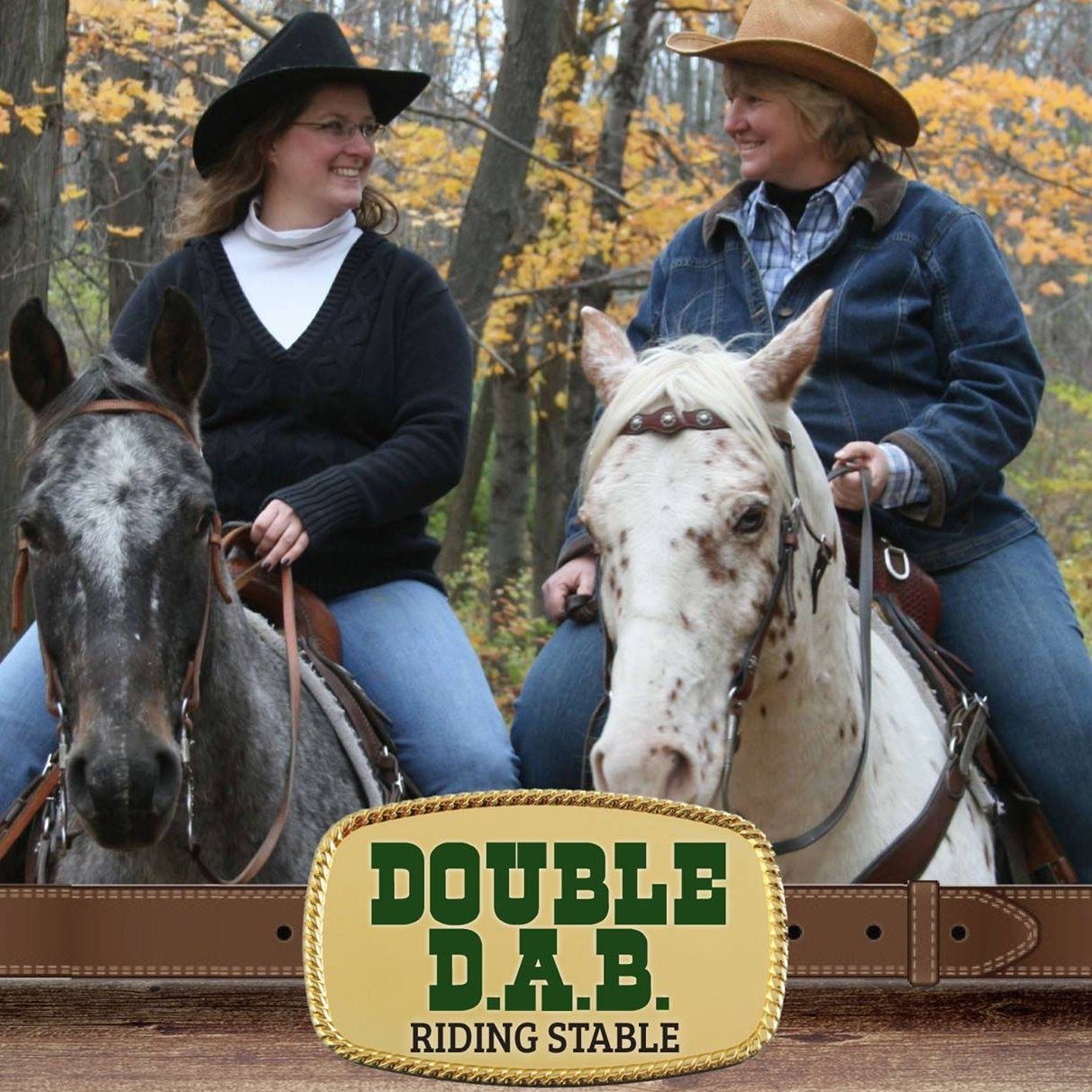 Two women are riding horses in front of a double d.a.b. riding stable sign