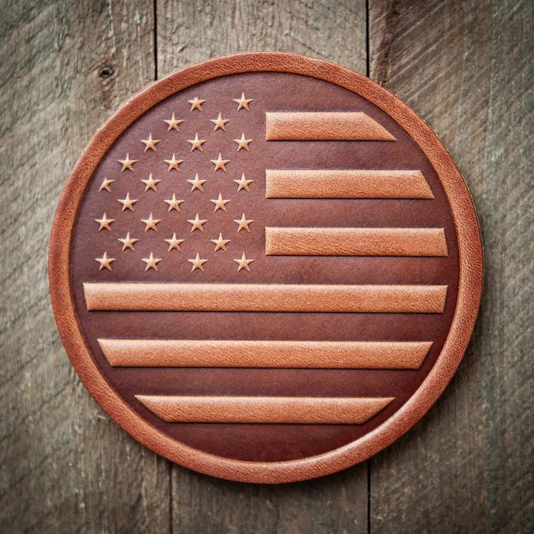 Round wooden American flag plaque on a rustic wood background