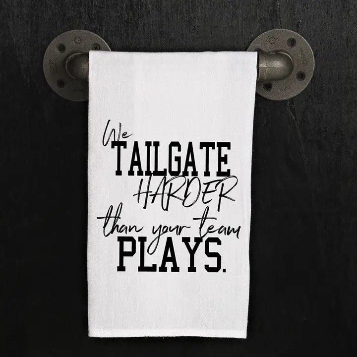 White towel with black and gray text: 