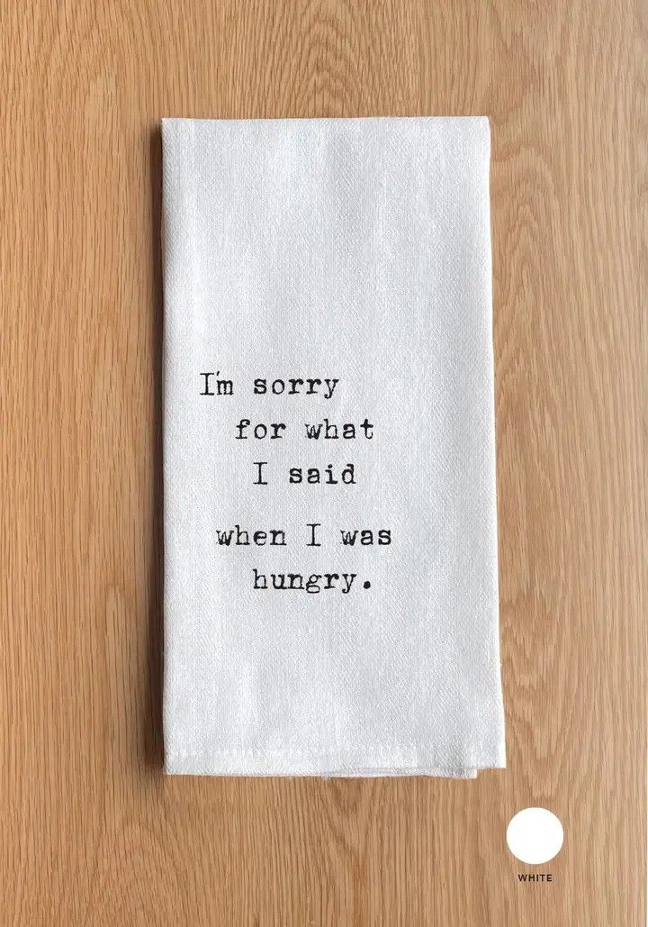 Small white paper note on wood with typed apology: “I’m sorry for what I said when I was hungry.”