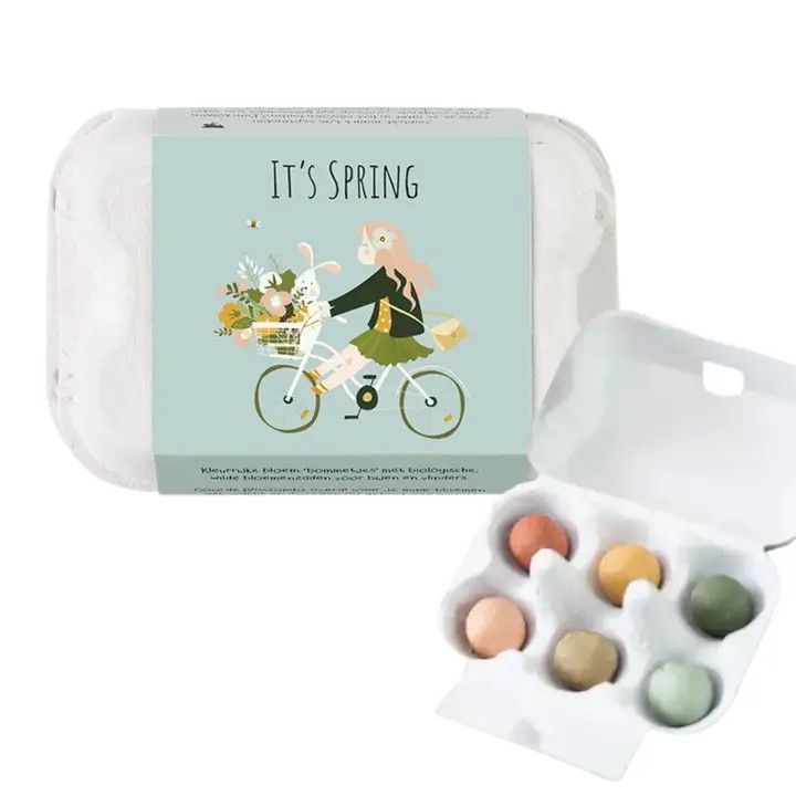 Spring-themed candy box with a girl on a bicycle and a tray of pastel candies