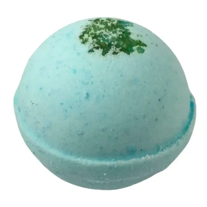 Light blue bath bomb with green speckles on top, shaped like a rounded sphere
