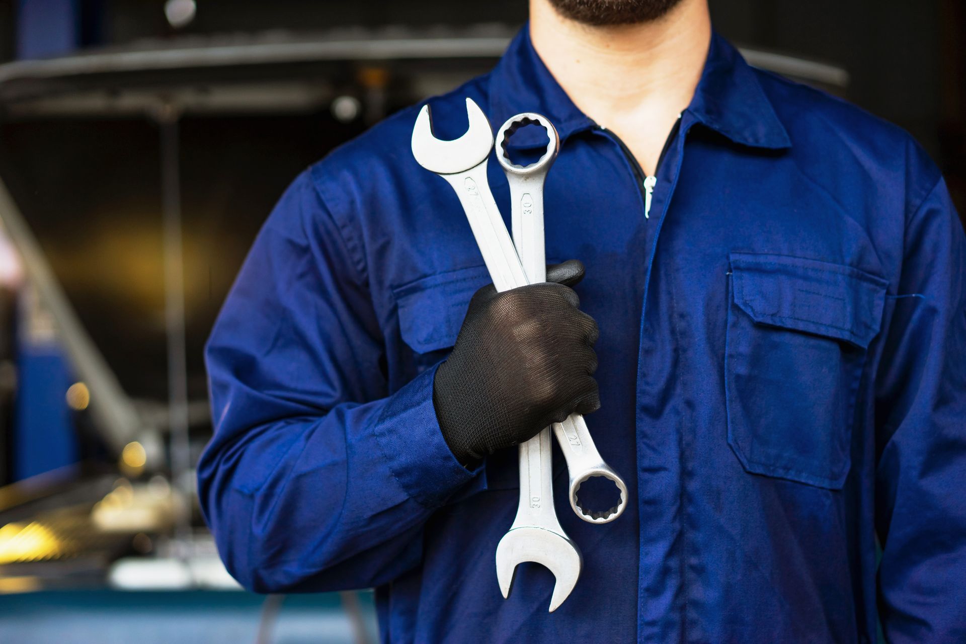 Technician from C. R. Smith Radiator & Auto Repair holding tools in Spring Grove, PA