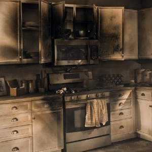 A kitchen with a stove top oven and a microwave